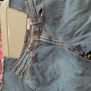 Chicos cut off and frayed straight leg jeans. Size 2